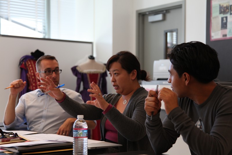 Cathy Kwan (middle) discusses a senior’s portfolio defense with assistant principal Matthew Hein (left) and Otoniel Ceballos, a recent graduate of Los Angeles High School of the Arts.