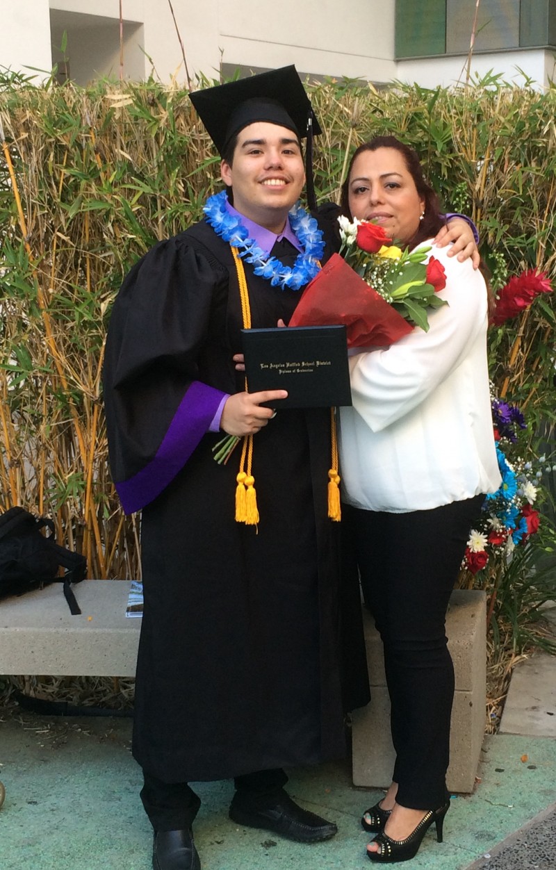 Jorge Magana poses with his mother after earning a diploma from Los Angeles High School of the Arts. He failed his portfolio defense, but passed it on a second try.