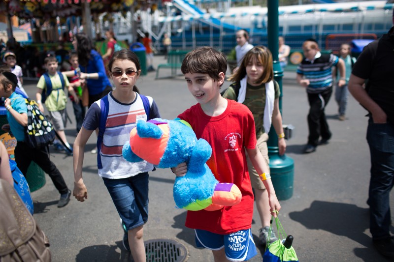 Student Etai Kurtzman, 12, wins a bear at the Roll-A-Ball game at Coney Island.