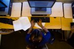 A student works on her memoir in a computer lab at Bronzeville Scholastic Academy High School on Chicago's South Side (Photo by Nick Pandolfo)