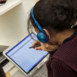 A School of One student works on a tablet computer with a live remote tutor. (Courtesy of School of One)