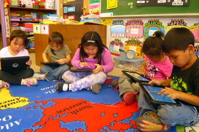Kindergartners in Gambell play on iPads at the end of the day. (Photo by Sarah Garland)