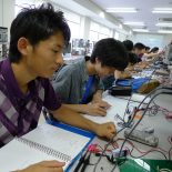 Students at Tokyo National College of Technology test their handmade diodes in a laboratory. (Photo by Blaine Harden)