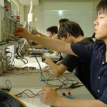 Students at Tokyo National College of Technology test their handmade diodes in a laboratory. (Photo by Blaine Harden)