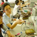 Students at Tokyo National College of Technology test their handmade diodes in a laboratory. (Photo by Blaine Harden)