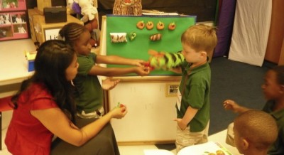Children play with puppets in a Drew Charter School classroom. (Photo by Sarah Garland)