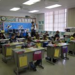 Third graders at Waconda's Glen Elder Elementary School prepare for Kansas Day by learning about and coloring in pictures of the state tree.  (Photo by Sarah Butrymowicz)
