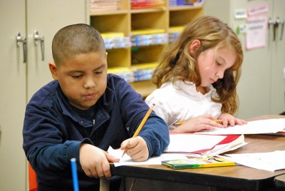 Third graders at Signal Hill Elementary work on a writing assignment. (Photo by Stephen Smith)