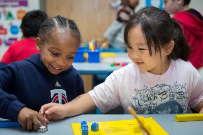 Kindergarten students Antwon Hollman, left, and Makayah Yang play a counting game Wednesday, June 5, 2013 in teacher Melanie Houff's class at Little Canada Elementary School. (Photo by Jennifer Simonson/MPR)