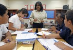 Ponce de Leon Middle School math teacher Phyllis Bellinger talks instructs (left to right) Denis Pacheco, Isabel Canizares, Jamie Brown and Javier Martinez. When Miami-Dade public schools rolled out their performance pay plan to fanfare and cheering last year, it was the first district in Florida to get a head start on what will become a mandated policy in 2014 and felt like it took on frontrunner status in the nation. "We're on the cutting edge for a large urban district," said Enid Weisman. Spurred on largely by competition for federal grants, the vast majority of states are in the midst developing performance pay models. Miami's system is a classic one as far as implementation goes with bonuses rewarded based on student performance on tests; its the kind that research has found doesn't make a significant change in student performance. So just where exactly does Miami rank among its national peers? With a sensitivity paid to getting teacher feedback and taking a multi-year approach to changing the culture, it holds more promise than failed ones in places like New York. But by sticking to test scores as the only variable, Miami is a step behind the multi-layered approaches in places like Denver and Austin. (Al Diaz / Miami Herald Staff)