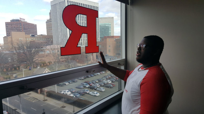Rutgers Newark freshman Saied Beckford, an 18-year-old freshman, points out downtown Newark landmarks from his seventh-floor suite in a campus residence hall.