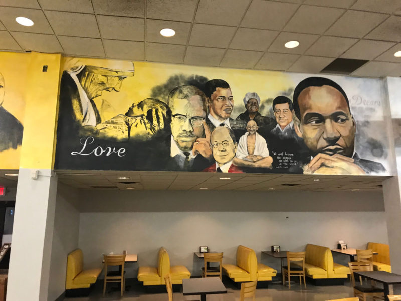 The dining hall walls at Paul Quinn College are painted with murals depicting famous African-Americans and other heroes.