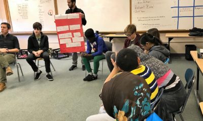 Curtis Chapin, a Crew advisor and language arts teacher at King Middle School in Portland, Maine, reviews the “Crew Contract” signed by each member.